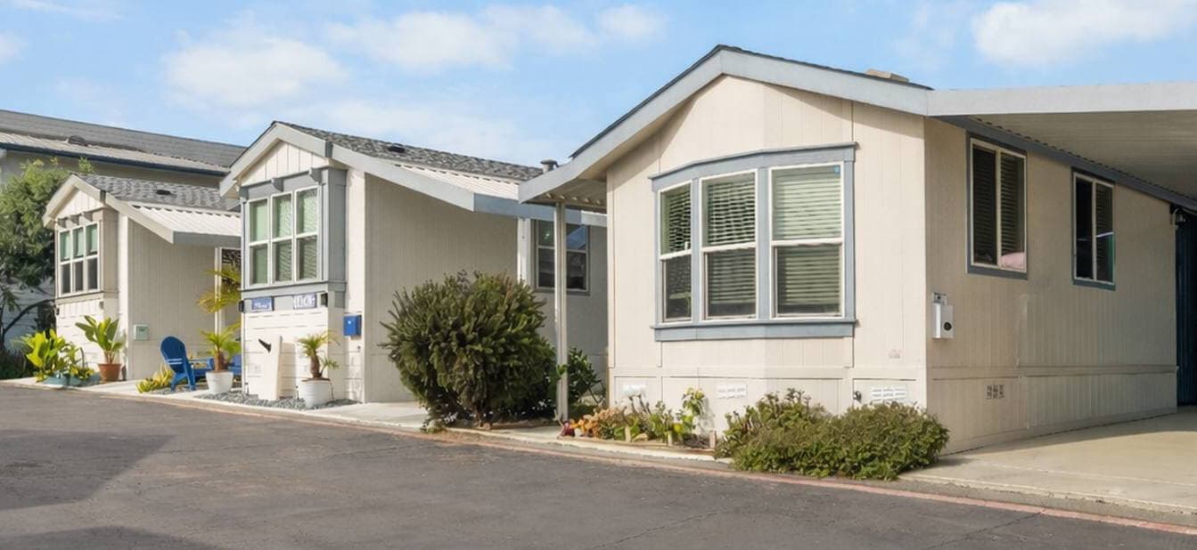 Modern manufactured home exterior with a beautiful lawn