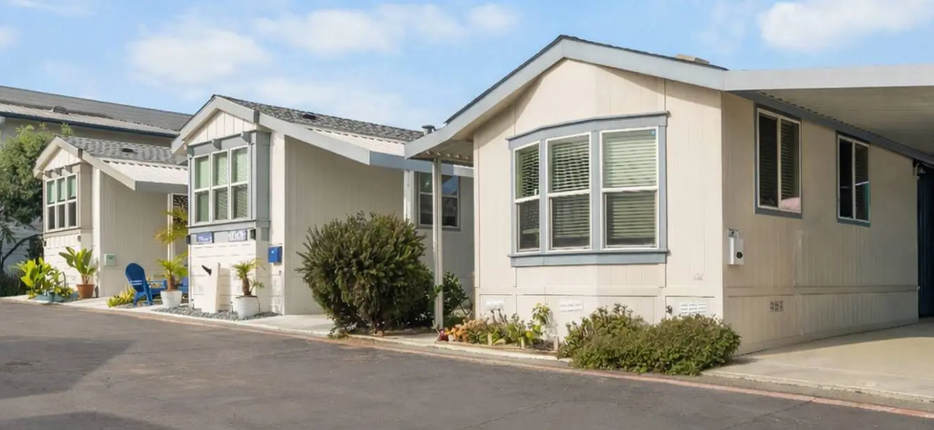 Modern manufactured home exterior with a beautiful lawn
